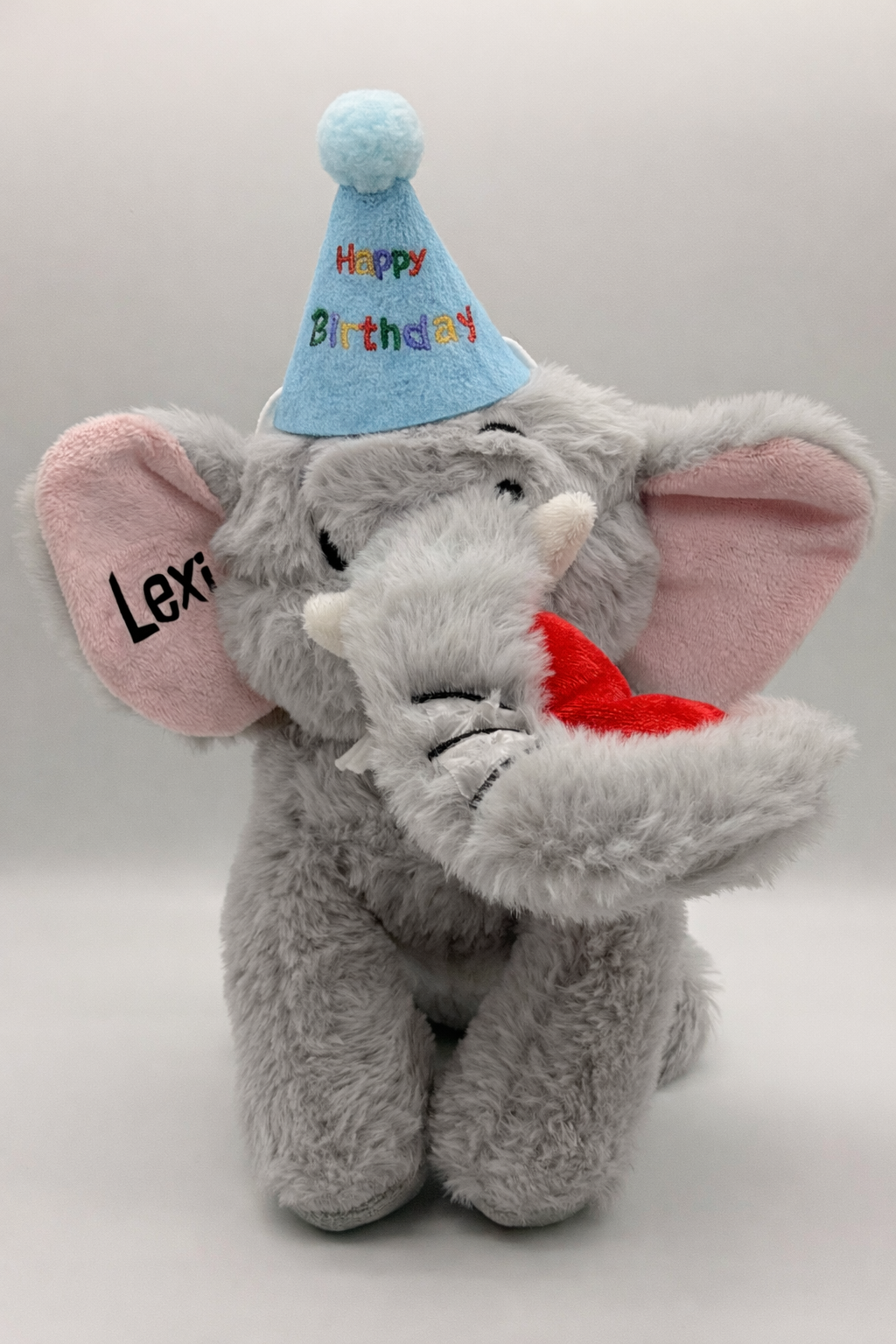 Personalised elephant dog toy with happy birthday hat
