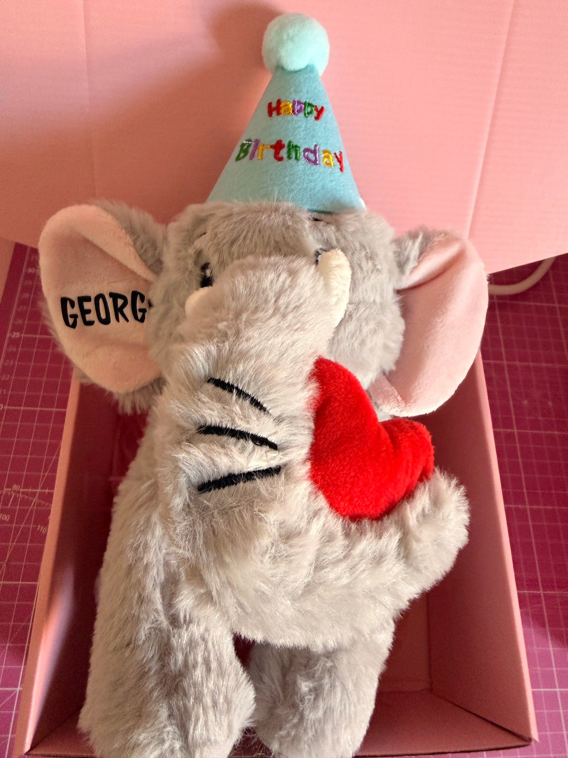 Personalised elephant dog toy with happy birthday hat