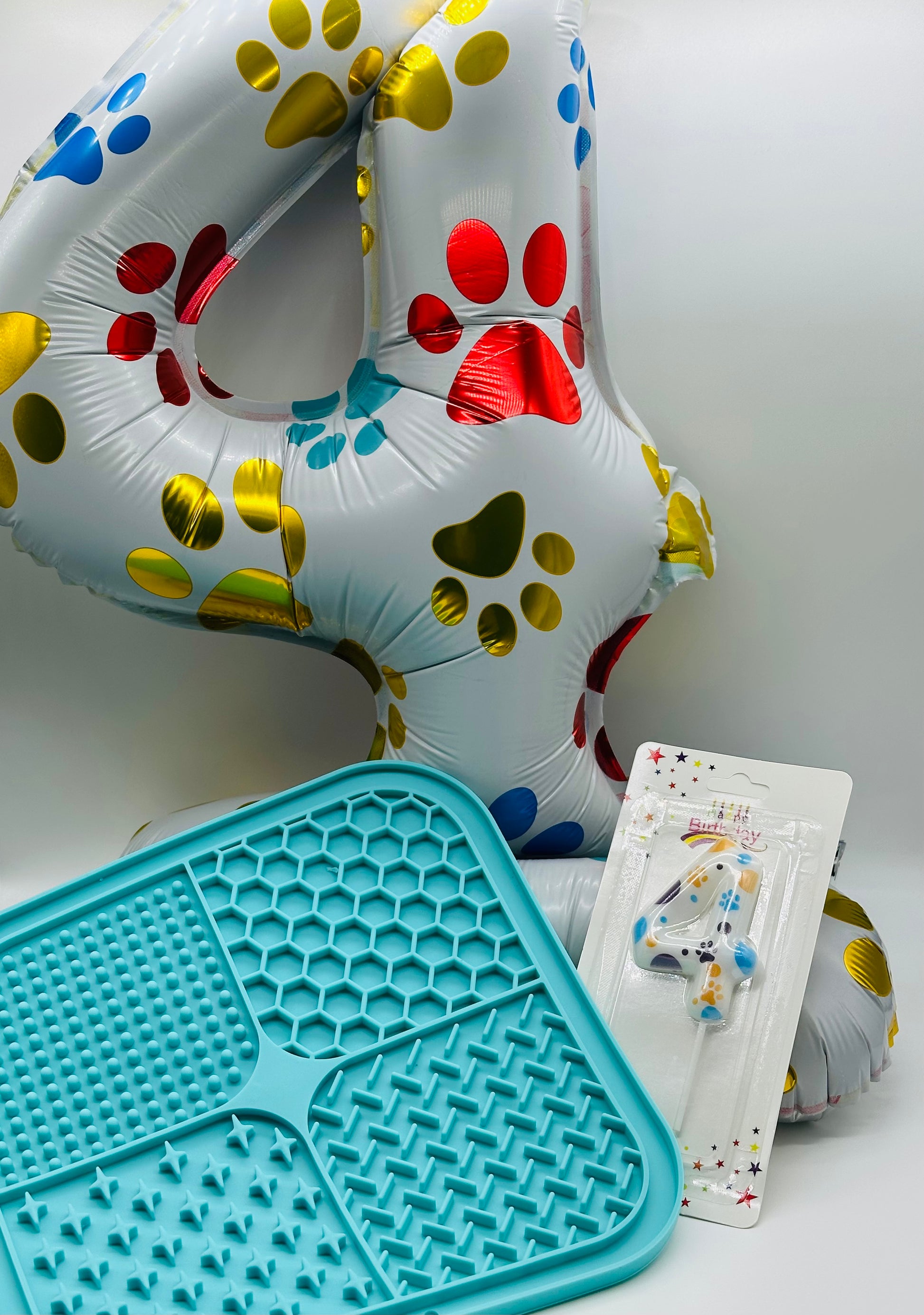 Pet birthday balloon, candle and lick mat