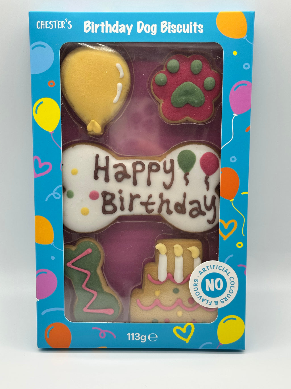 Dog birthday box with birthday biscuits, a soft squeaky bone and a ball